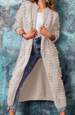 Women's maxi-length knitted cardigan with pompom details